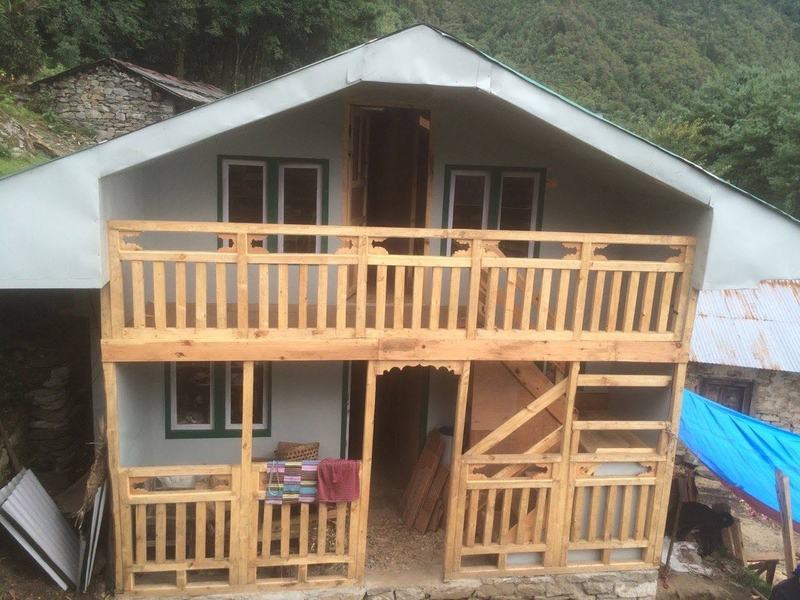 A two-storey timber-framed house built by trainees in Lukla